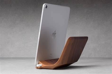 This handcrafted iPad Pro Stand carved from a single piece of wood comes with a magnetic Apple ...