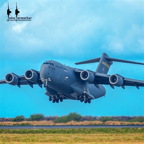 a large air plane taking off from an airport runway with the landing ...