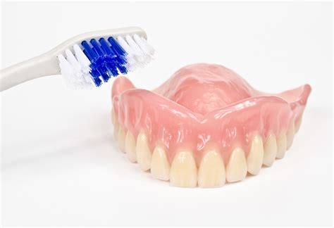 Instructions on How to Properly Clean Your Dentures - Arrow Smile Dental