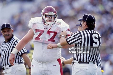 Brandon Burlsworth of the Arkansas Razorbacks is helped by an... News Photo - Getty Images