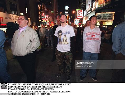 New Yorkers stop to watch the "Seinfeld" finale in Times Square, 1998 ...