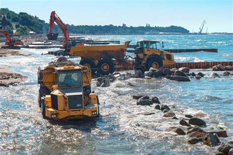 Construction Of Breakwaters, Construction Equipment On The Sea Coast Editorial Photography ...