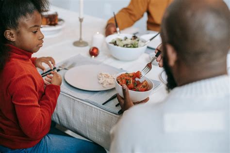 Black family having tasty dinner · Free Stock Photo