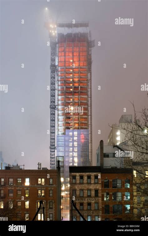 Trump Soho apartment building under construction in New York City photographed on a foggy night ...