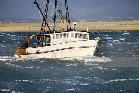 Small Fishing Trawler In Rough Seas New Zealand Stock Photo | Getty Images