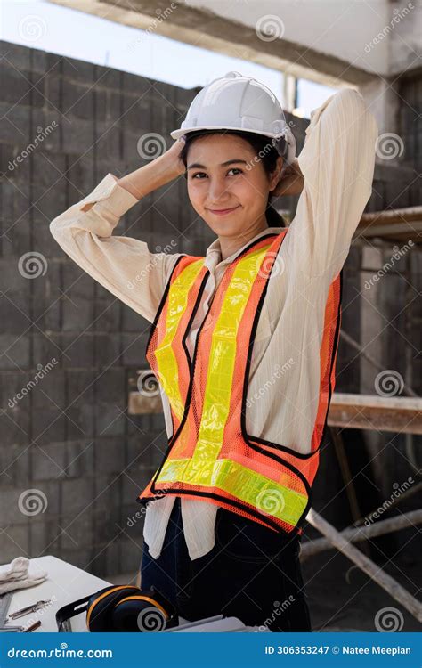Female Construction Engineer. Architect with a Blueprint at a ...