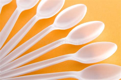 White Plastic Spoons stock photo. Image of yellow, plastic - 1848934