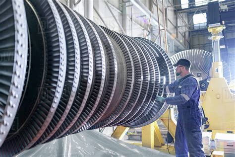 Engineer working on high pressure steam turbine in turbine maintenance factory - Stock Photo ...