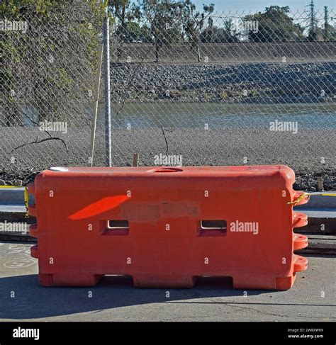 orange water fill plastic barricade in California Stock Photo - Alamy