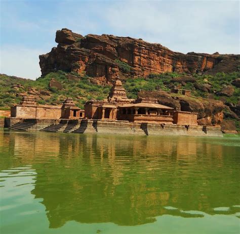 Badami. The Bhutanatha Temple Complex and a red rock wall, as viewed ...