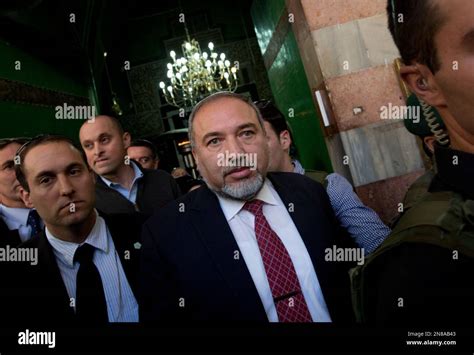 Israel's former Foreign Minister Avigdor Lieberman, center, visits the site known to Jews as the ...