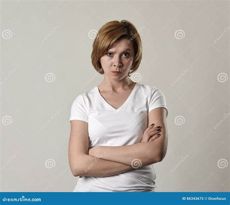 Young Attractive and Moody Woman Posing Alone Angry and Upset in Bad Mood and Rage Face Stock ...