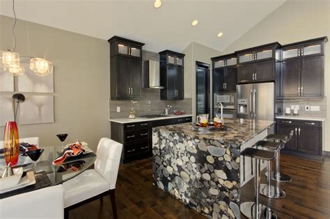 Natural stone granite countertop with waterfall down one side of island - Olympia II Show Home ...