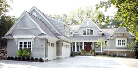 gray siding house with brown roof - Kristofer Whitlow