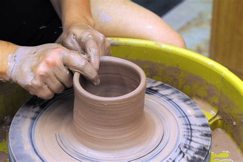 Opening Clay on a Pottery Wheel for Beginners - Spinning Pots
