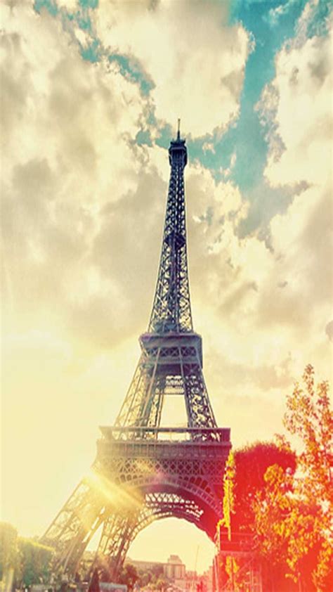 Download The Eiffel Tower standing tall in Paris Wallpaper | Wallpapers.com