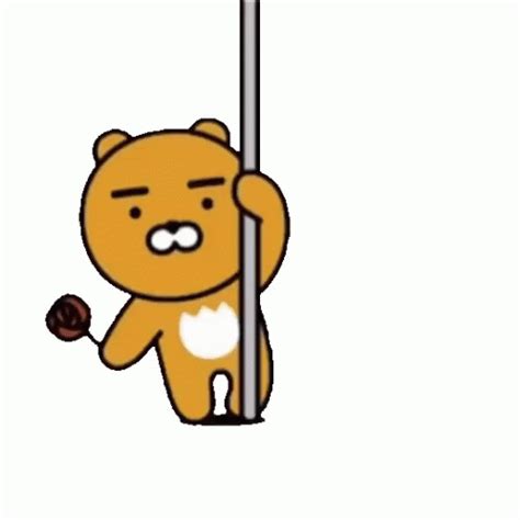 a brown teddy bear holding onto a pole