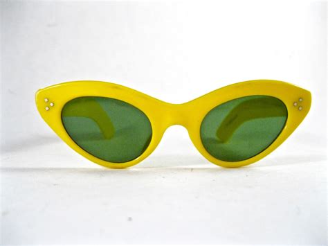 RESERVED vintage yellow cat eye sunglasses. 1960s mod