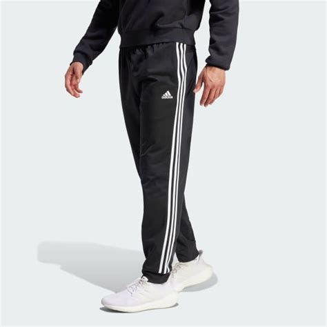 adidas Essentials Warm-Up Tapered 3-Stripes Track Pants - Black | Free Shipping with adiClub ...