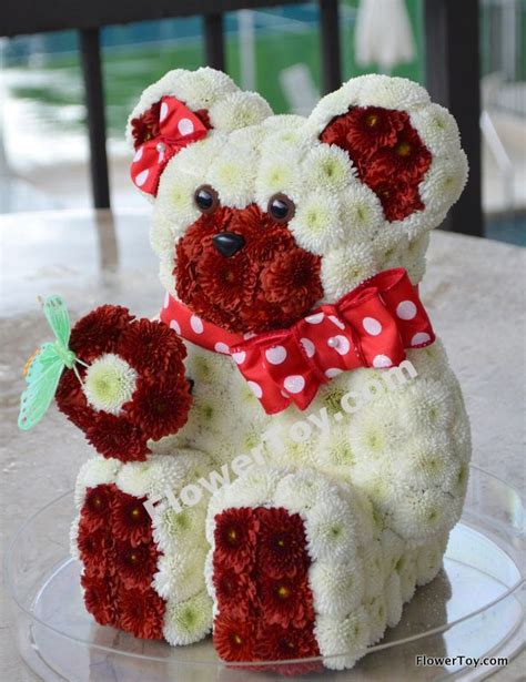 This cute teddy bear arrangement is made from fresh flowers. Visit our ...