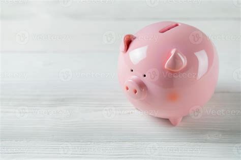 Pink Piggy bank on white wood floor 3412334 Stock Photo at Vecteezy