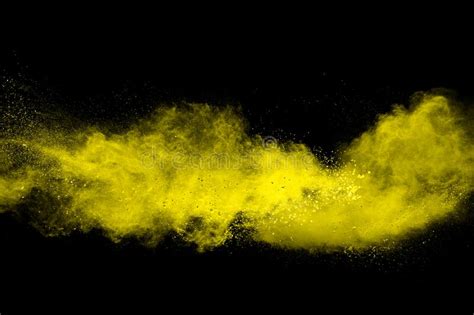 Yellow Dust Particle Explosion on Black Background.Yellow Powder Splash ...