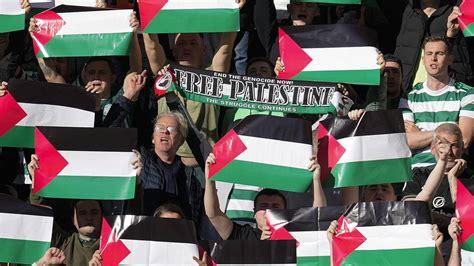 Celtic fans hold up Palestine flags during Scottish Premiership match ...