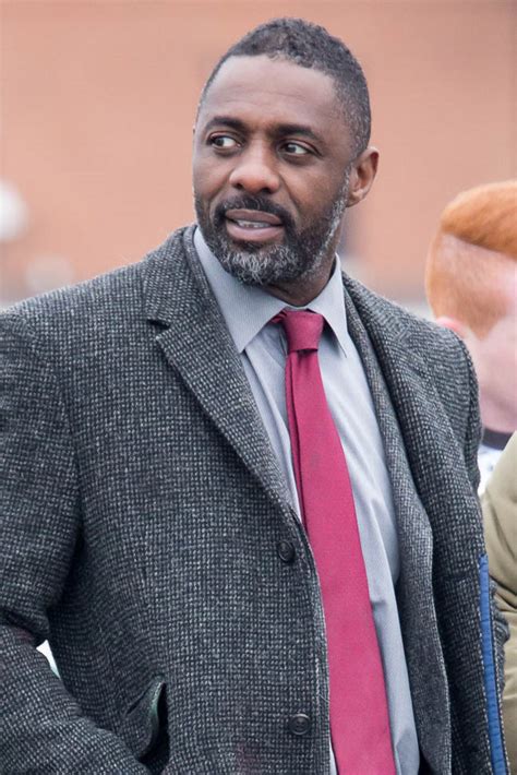 Idris Elba in a red tie on the set of Luther Friday send-off|Lainey Gossip Entertainment Update