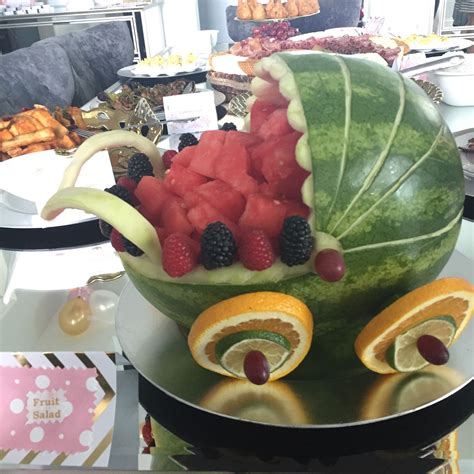 Baby carriage watermelon carving | Baby shower fruit tray, Baby shower watermelon, Baby shower fruit