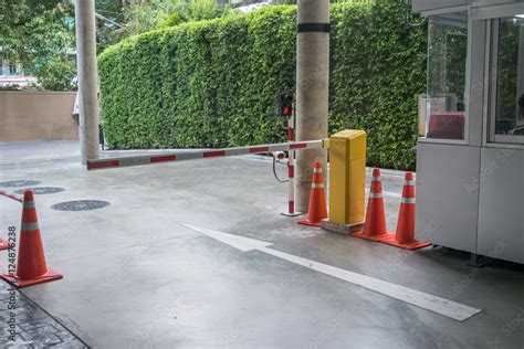 Parking toll booth and barrier stop bar with stop sign Stock Photo | Adobe Stock