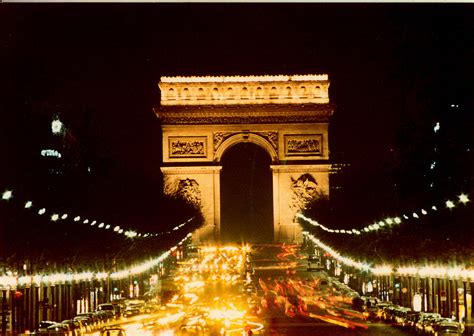 The Arc de Triomphe at Night Photograph by Thomas Bezigian