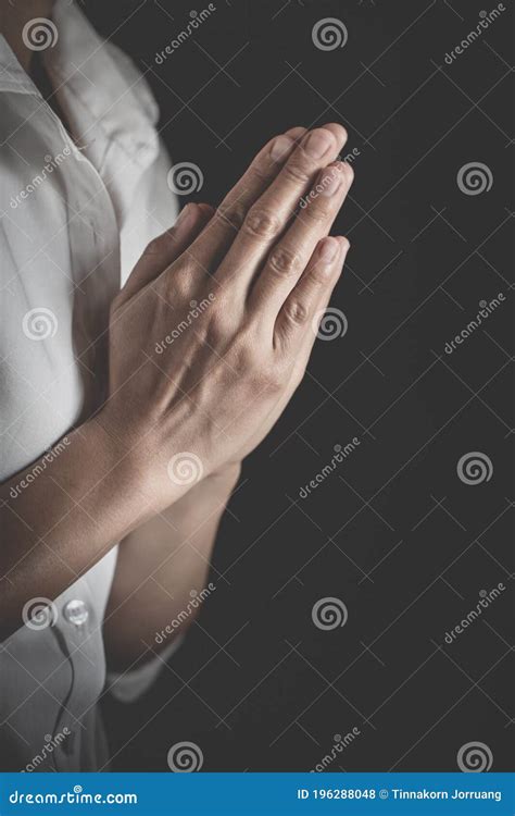 Praying Hands with Faith in Religion and Belief in God on Dark Background. Pay Respect Stock ...