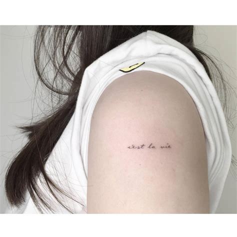 "C'est la vie" lettering tattoo handwritten on the