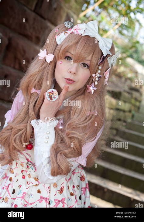 Female model in Cosplay Lolita Clothes outdoors near steps Stock Photo ...