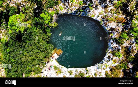 Blue hole , giant sinkhole in the Bahamas. These sinkholes were made by ...