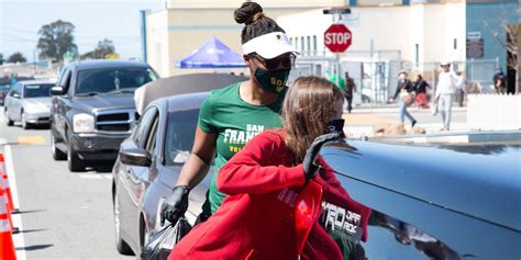 USF Women’s Volleyball Team helps with food distribution to families in ...