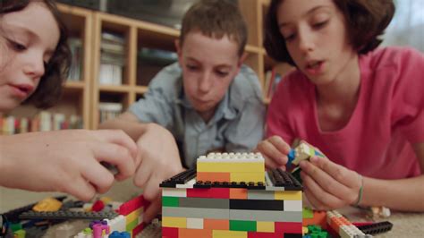 Three Kids Playing With Lego Bricks At Home Stock Footage SBV-327184178 ...