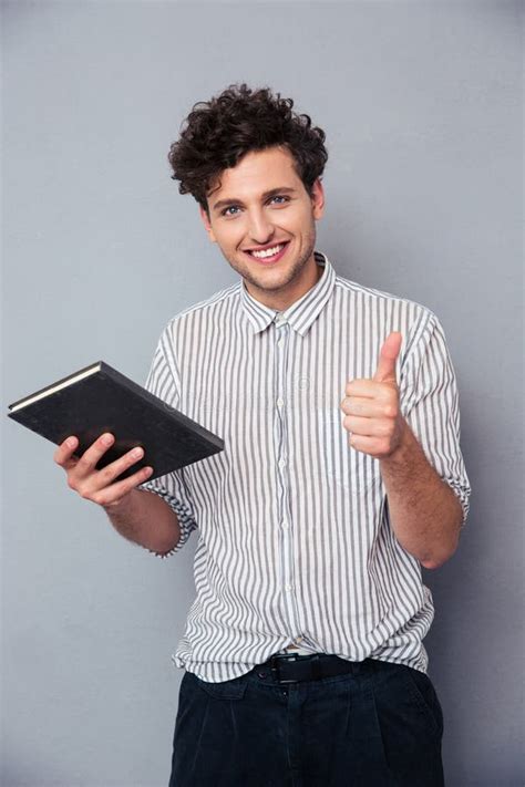 Man holding book stock photo. Image of college, lifestyle - 79043328