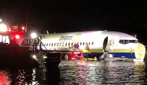 Plane with 150 people aboard skids off runway into Florida river