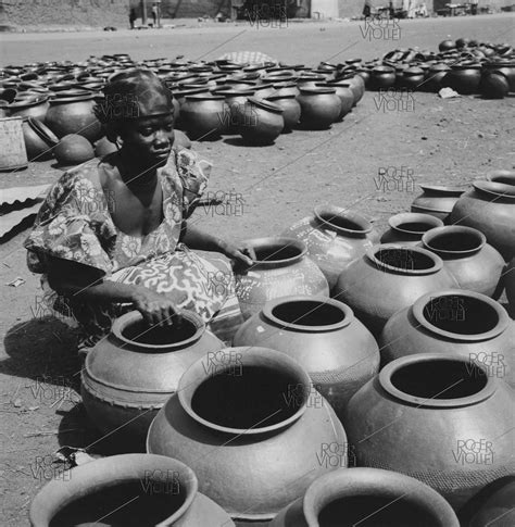 Pottery seller at the market. Bobo-Dioulasso (French Upper