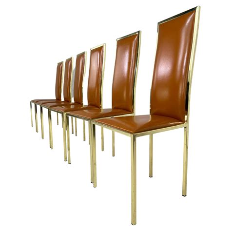 1970s Italian Style Renato Zevi Design Cognac Leather And Brass Set of 6 Chairs For Sale at 1stDibs