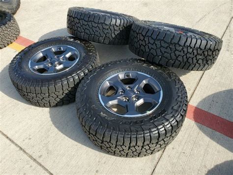 17" Jeep Gladiator Rubicon 2022 2023 OEM Wheels and Falken Wildpeak A/T3 Tires | 09236