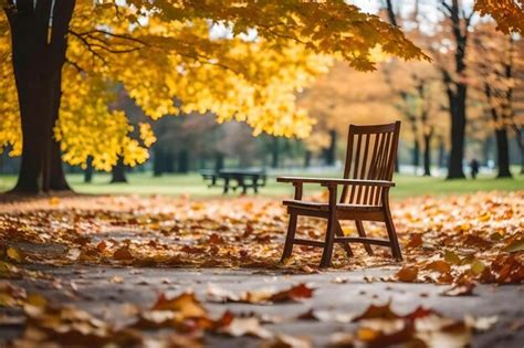 Premium AI Image | a wooden chair in a park with autumn leaves on the ground