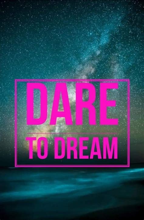 the words dare to dream in pink against a night sky