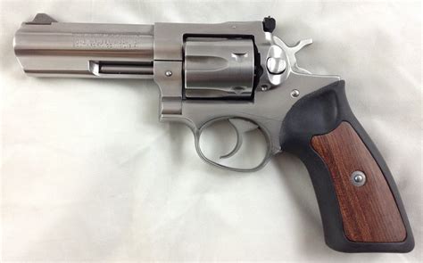 SOLD: Ruger GP100 stainless steel, 4" barrel, wood/rubber grips, 357 ...