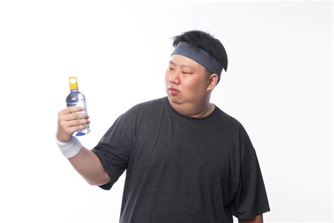 Asian funny fat sport man holding water bottle 3086603 Stock Photo at ...