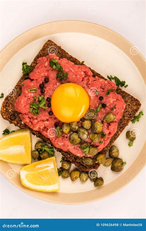 Steak Tartare with Capers and a Raw Egg Stock Photo - Image of minced, sandwich: 109626498