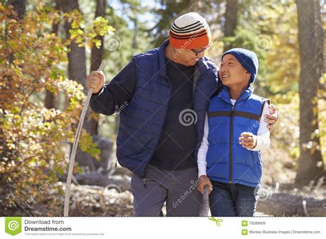 Dad and Son Hiking in Forest Embrace Looking at Each Other Stock Image - Image of hiking, close ...