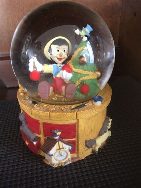 Disney Pinocchio Christmas Snow Globe Music Box Deck the Halls by ...