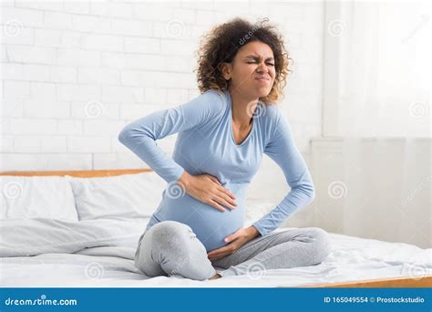 Labor Contractions. Pregnant Woman Having Pain in Belly Stock Photo ...